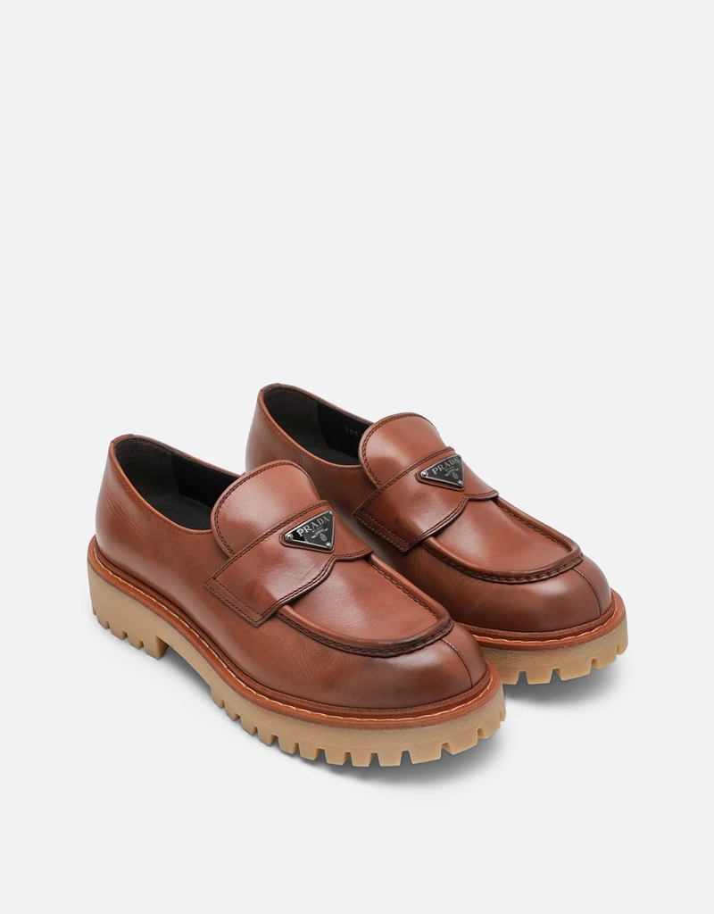 Prada メンズエボニーレザーのローファー () IFCHIC.COM