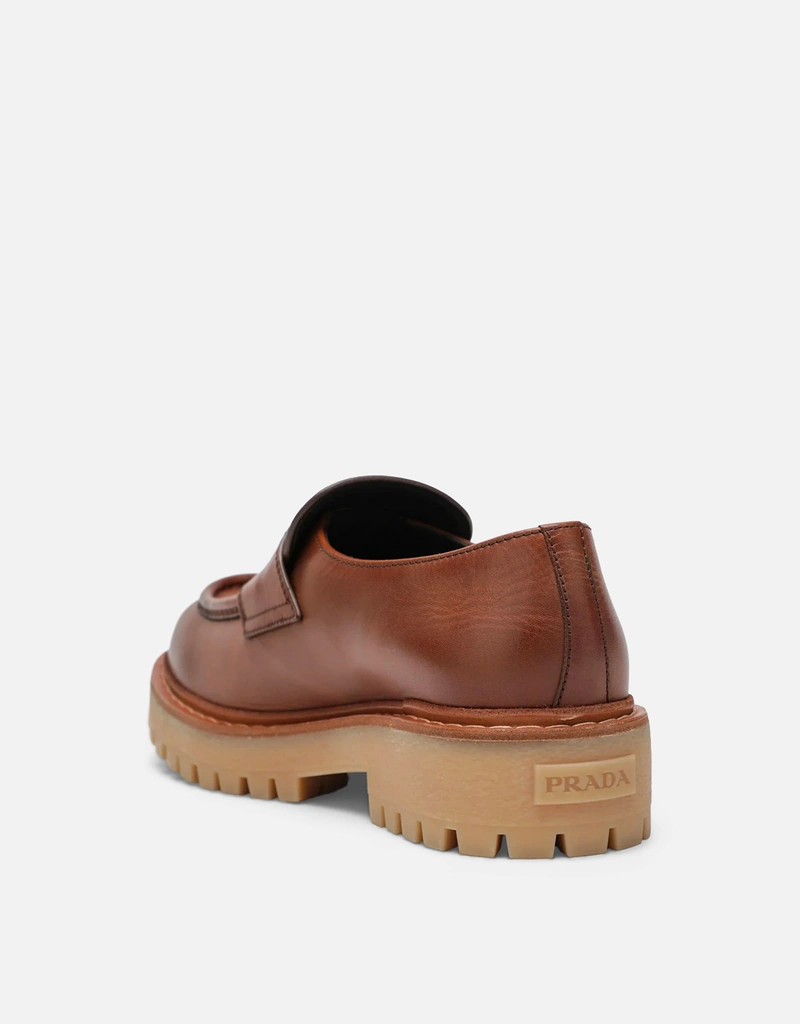 Prada メンズエボニーレザーのローファー () IFCHIC.COM
